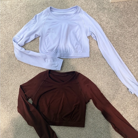 Alphalete Tops - Alphalete Long Sleeve Crop Tops in light purple and burgundy- never worn.